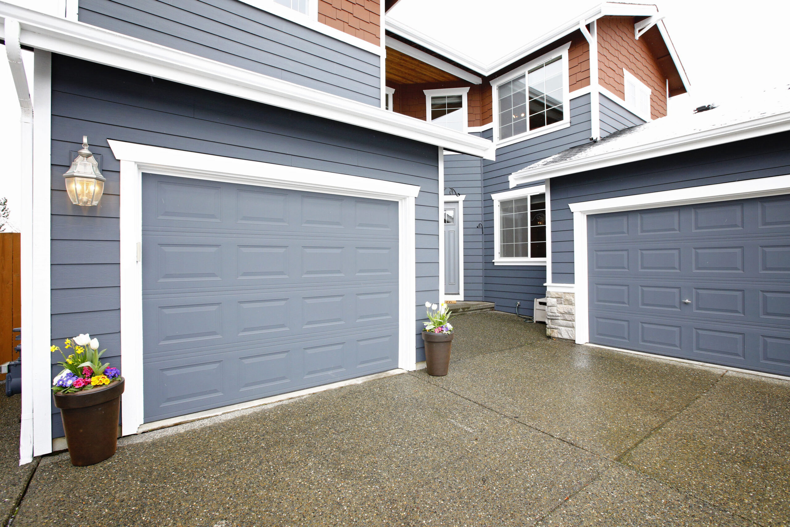 Why is My Garage Floor Wet When it Rains? Exterior of Garage After Rainfall