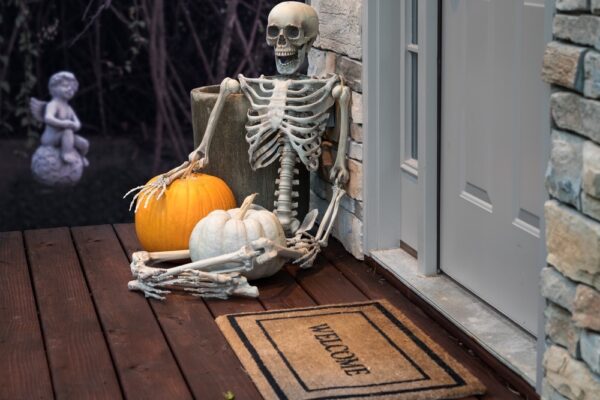 Halloween skeleton decoration on front porch.