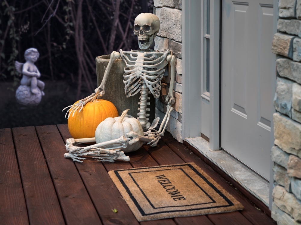 Halloween skeleton decoration on front porch.