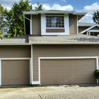 Garage door with lights on.