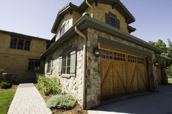 exterior of a home with wood garage door - Custom Garage Doors: From Wood to Finish and Everything In Between