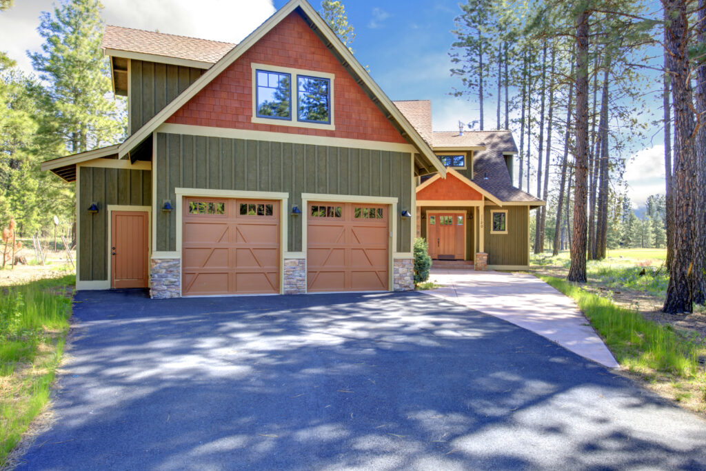 do garage doors need maintenance? exterior of home in mountainous area